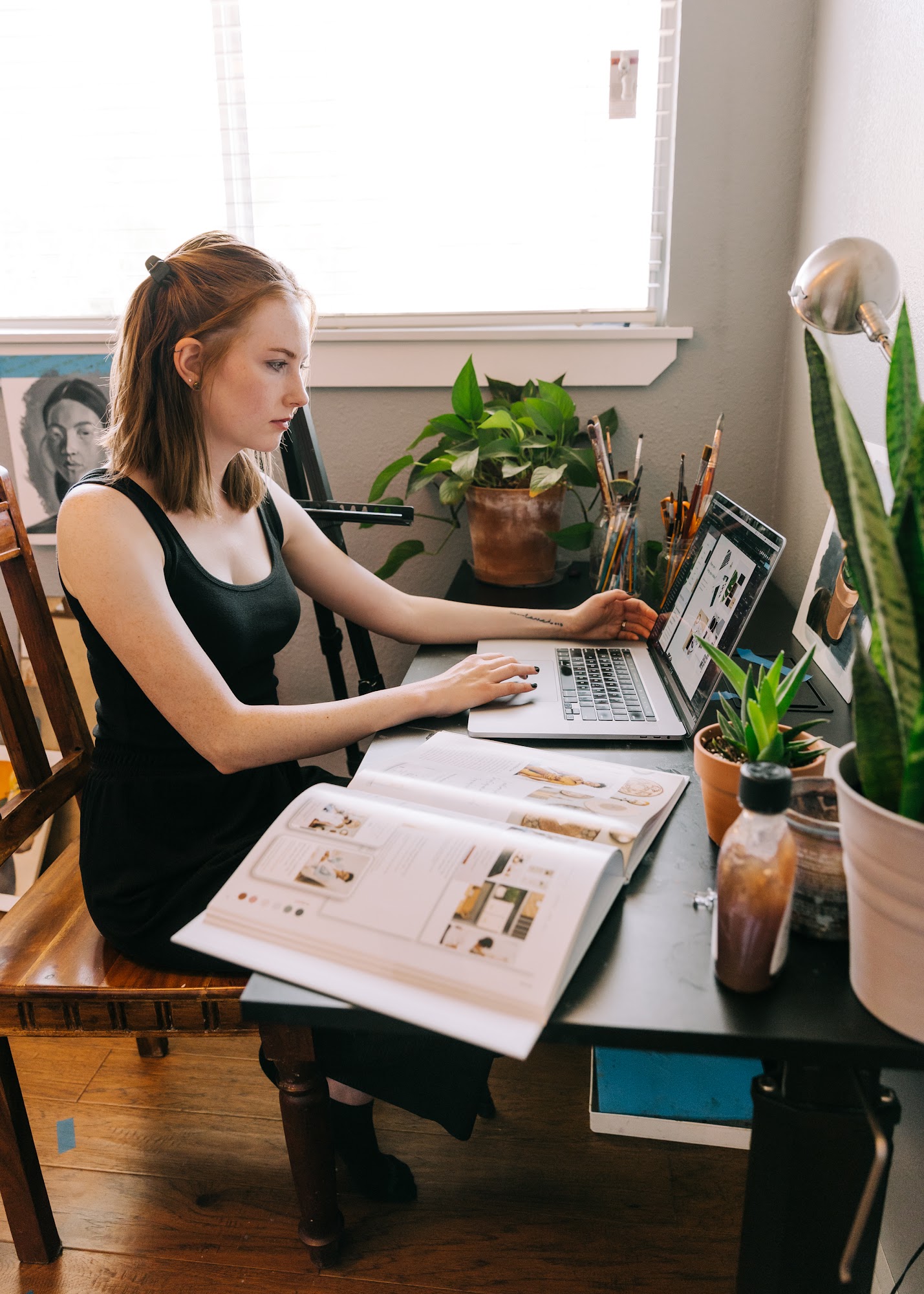 Alyssa Janss working doing art with a computer
